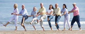 Eight retirees congoing on the beach